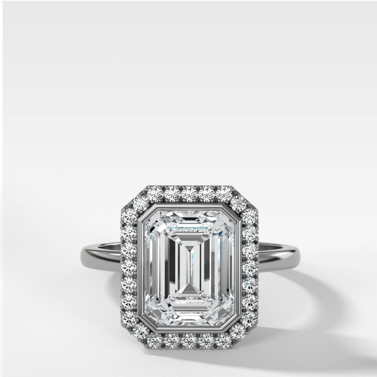 Bezel Set Halo Engagement Ring With Emerald Cut Diamond - GOODSTONE