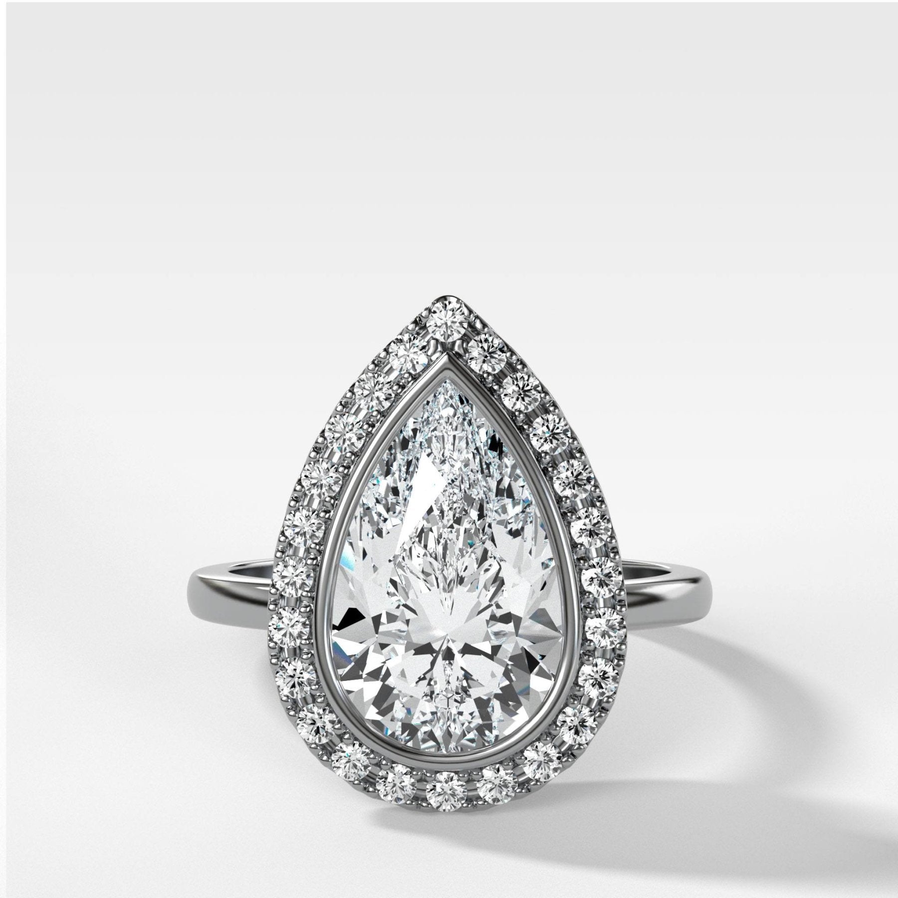 Bezel Set Halo Engagement Ring With Pear Cut Diamond - GOODSTONE