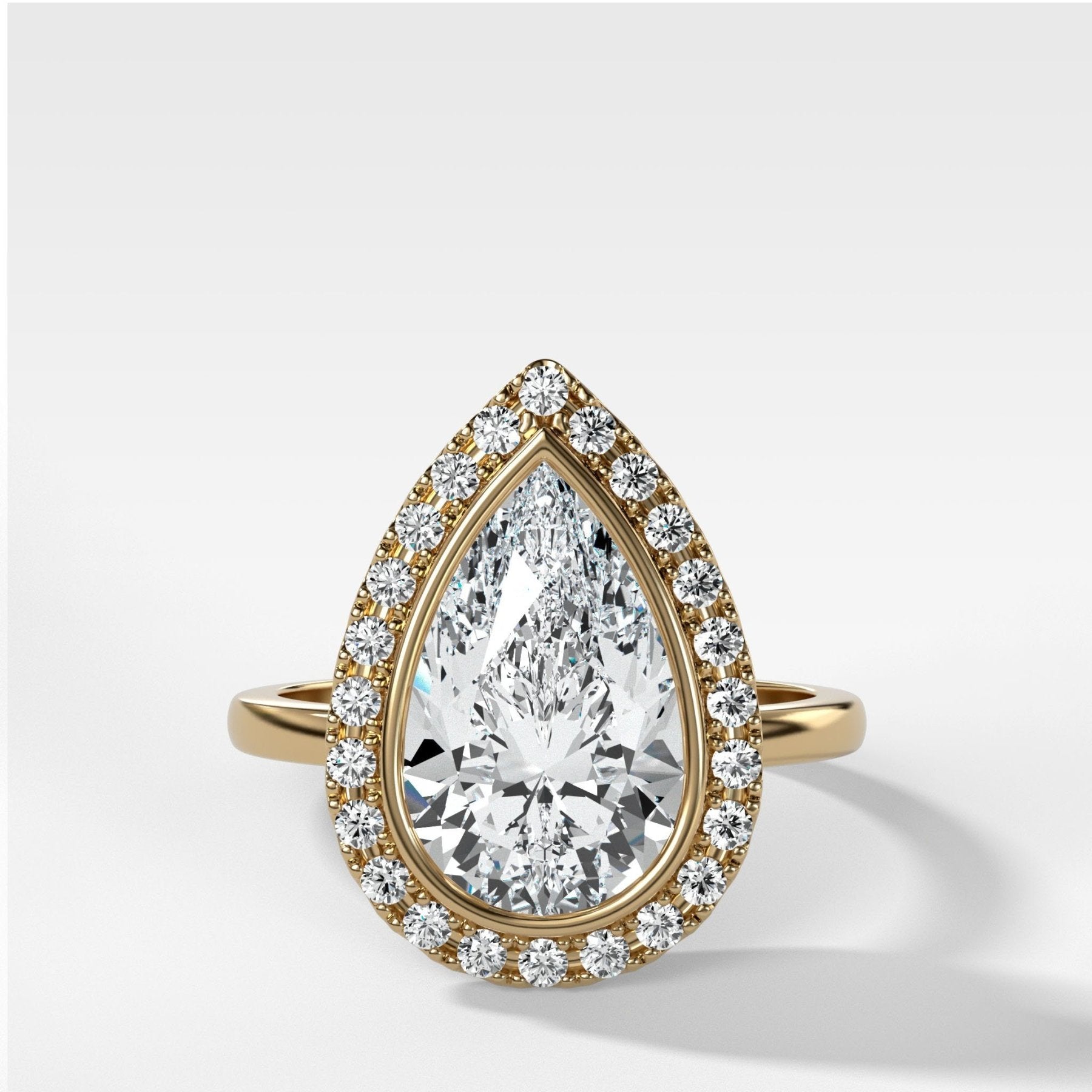 Bezel Set Halo Engagement Ring With Pear Cut Diamond - GOODSTONE