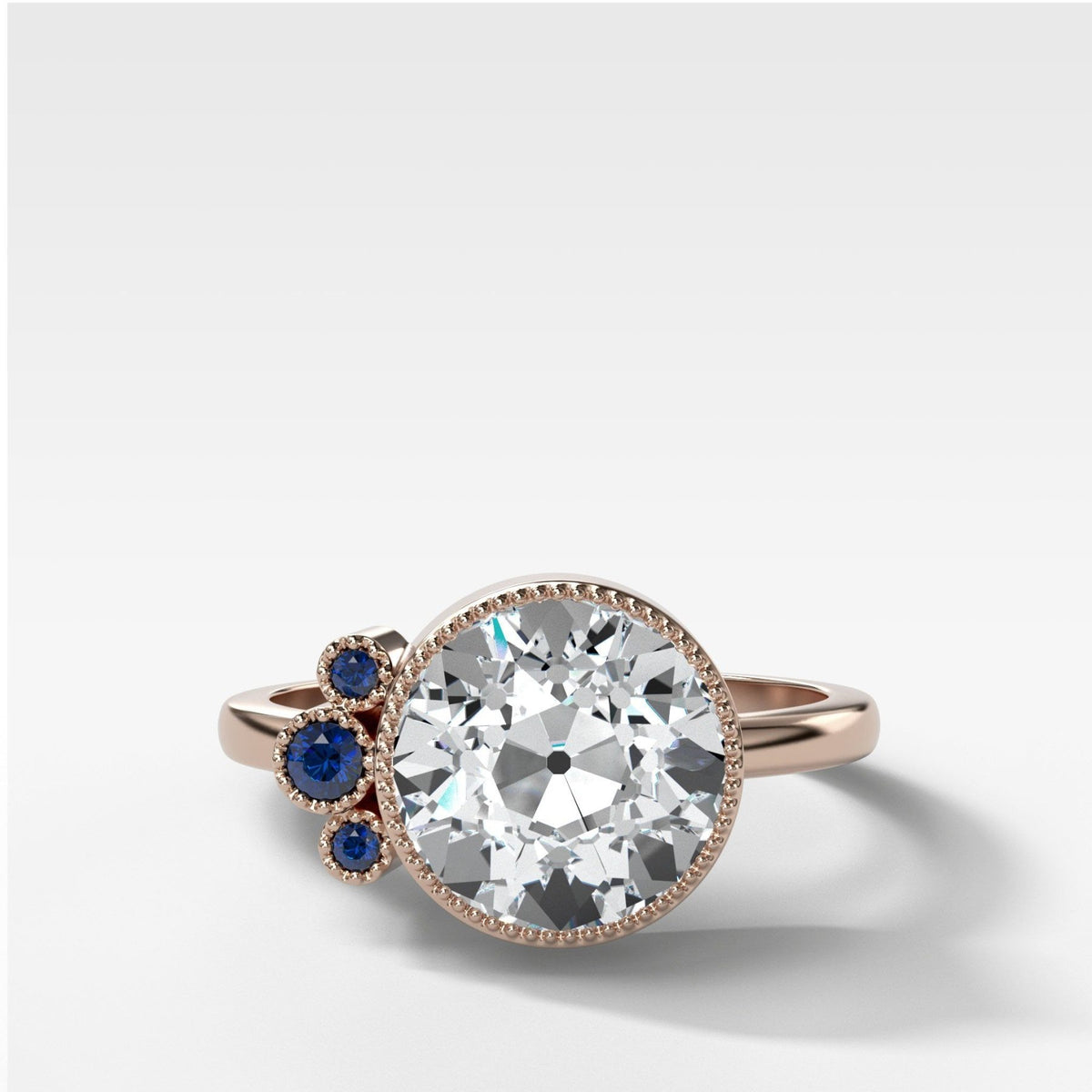 Anillo de compromiso en racimo azul con talla europea antigua de Good Stone en oro rosa