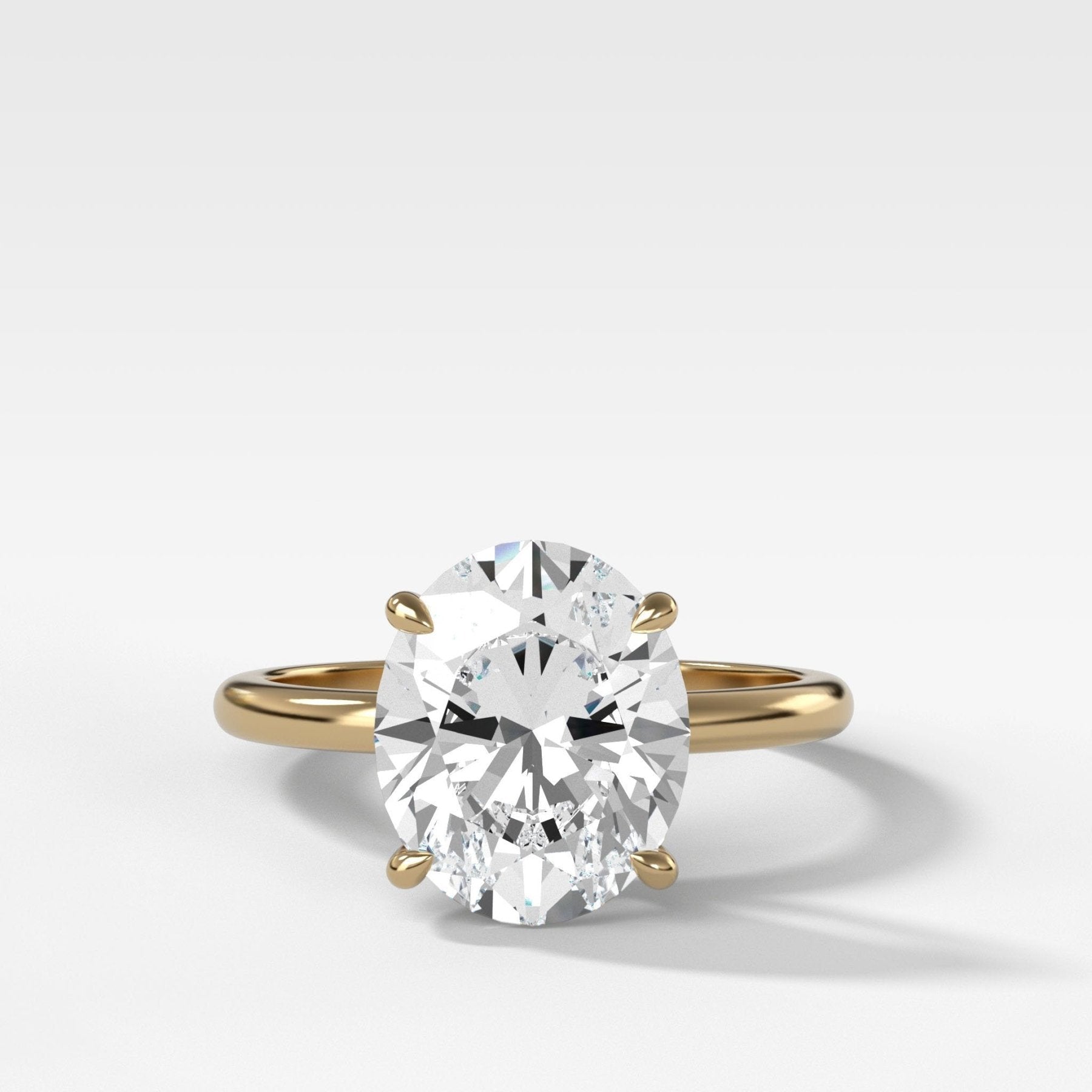 Crescent Solitaire Engagement Ring With Oval Cut Diamond - GOODSTONE