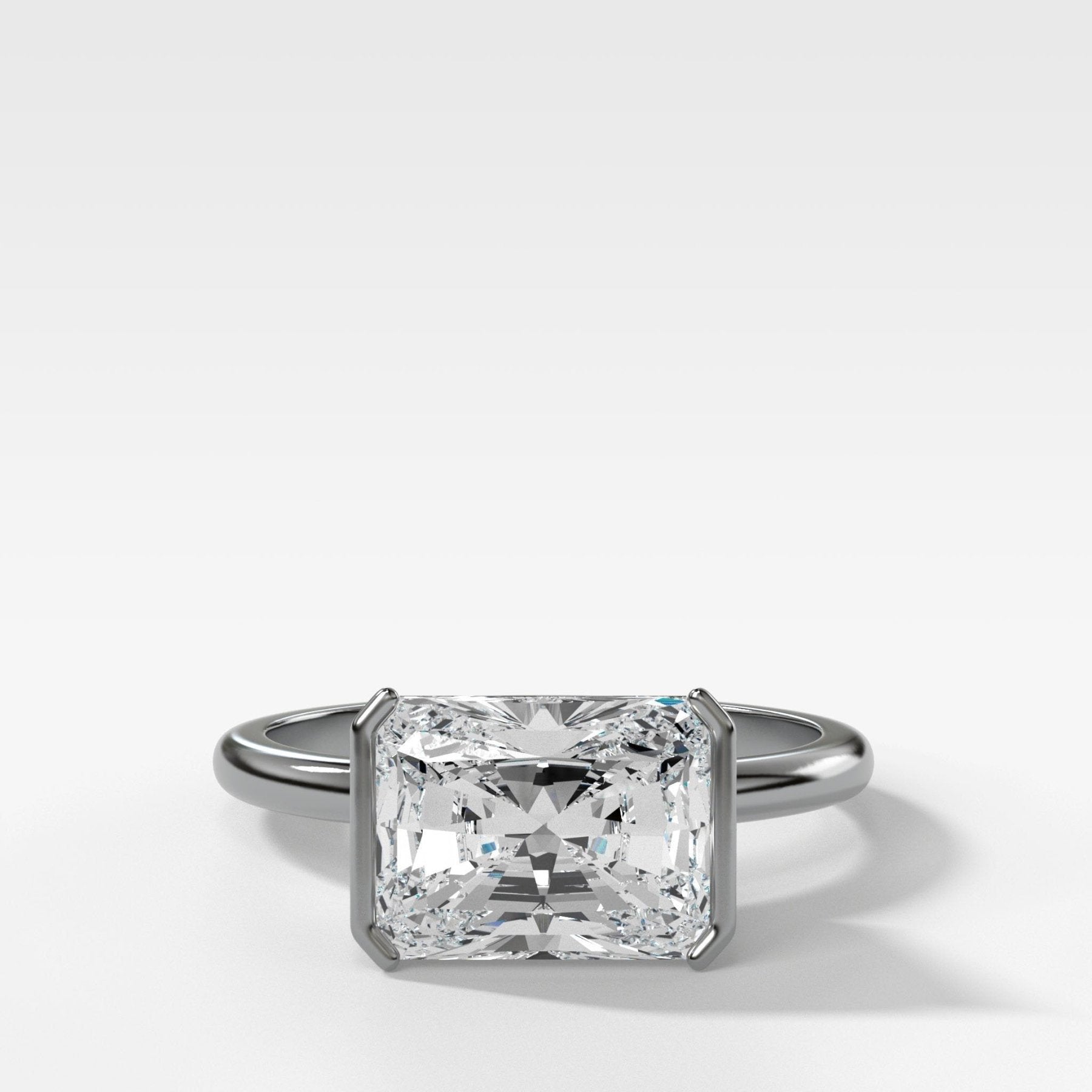 East West Half Bezel Solitaire Engagement Ring With Elongated Radiant Cut Diamond - GOODSTONE