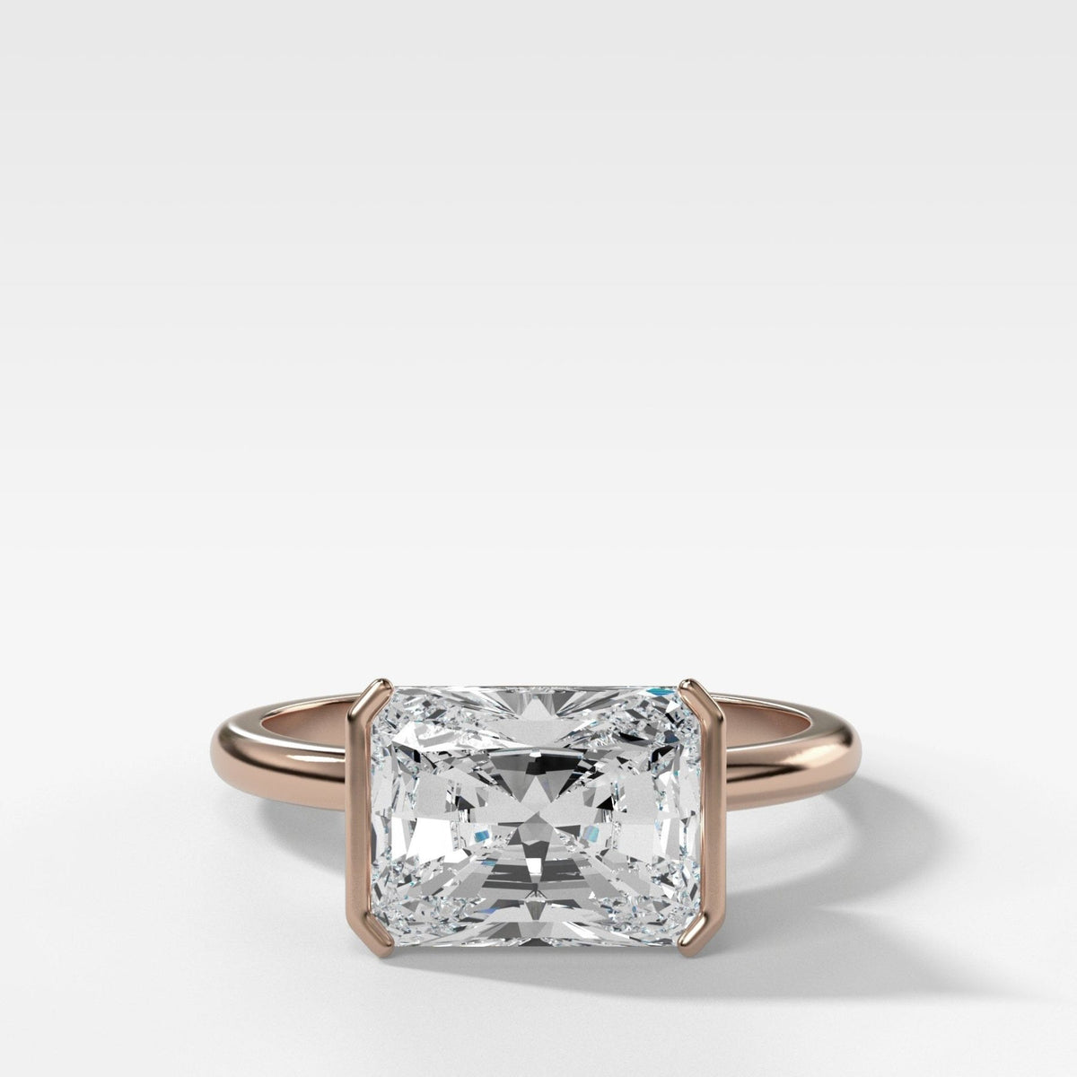 East West Half Bezel Solitaire Engagement Ring With Elongated Radiant Cut Diamond - GOODSTONE