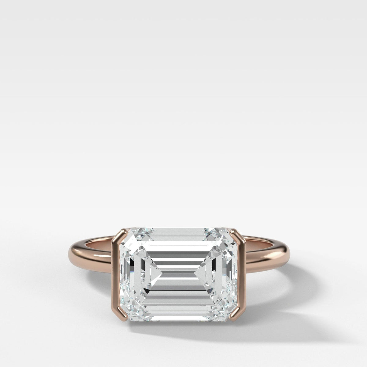 East West Half Bezel Solitaire Engagement Ring With Emerald Cut Diamond - GOODSTONE
