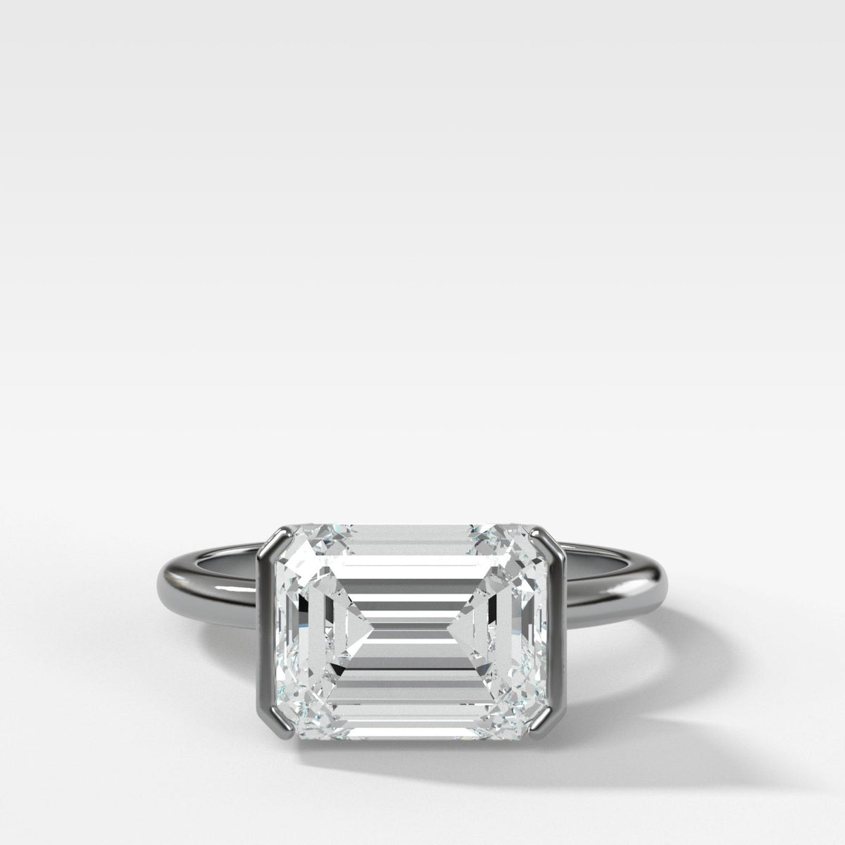 East West Half Bezel Solitaire Engagement Ring With Emerald Cut Diamond - GOODSTONE