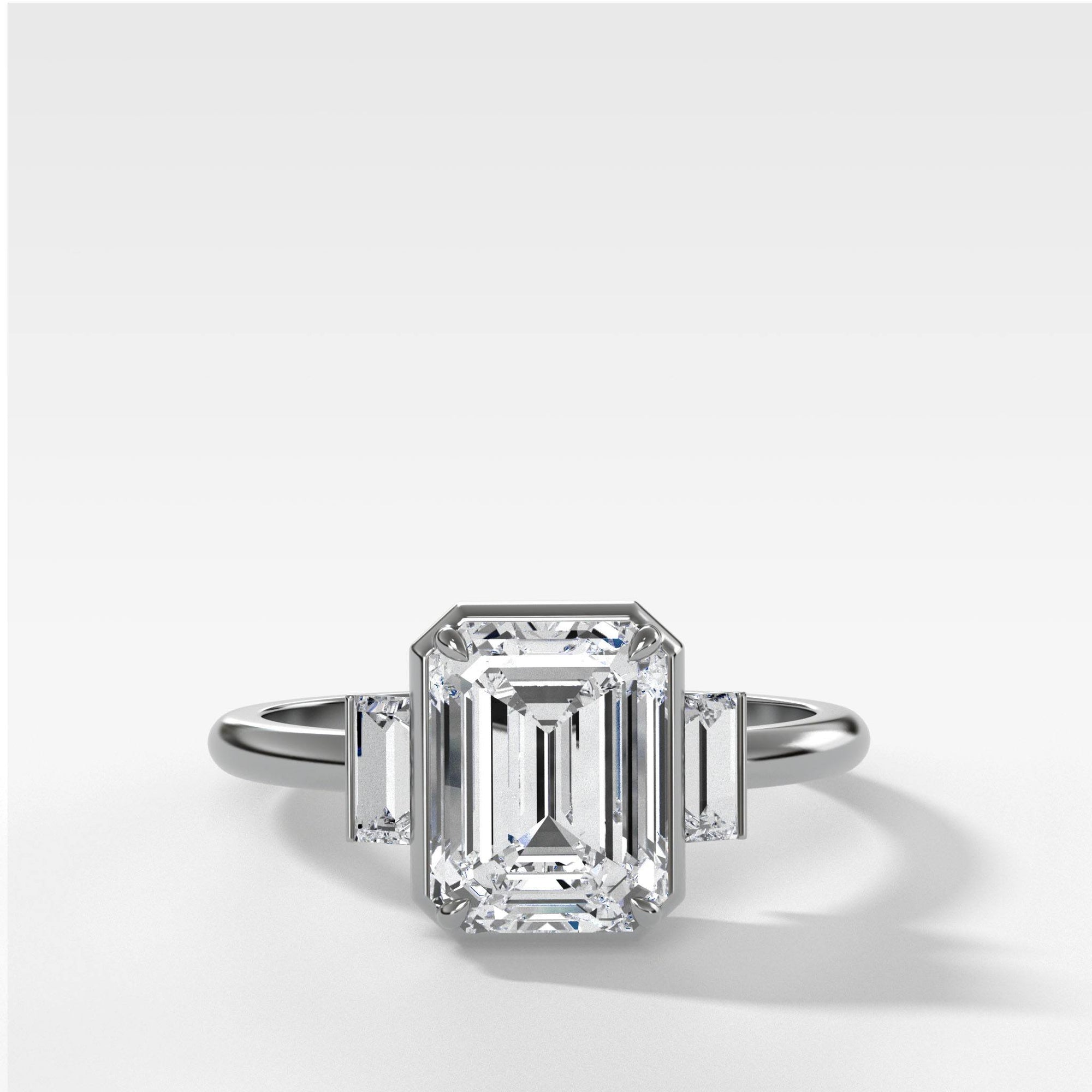 Three Stone Engagement Ring With Straight Baguette Side Stones and Emerald Cut by Good Stone in Yellow Gold