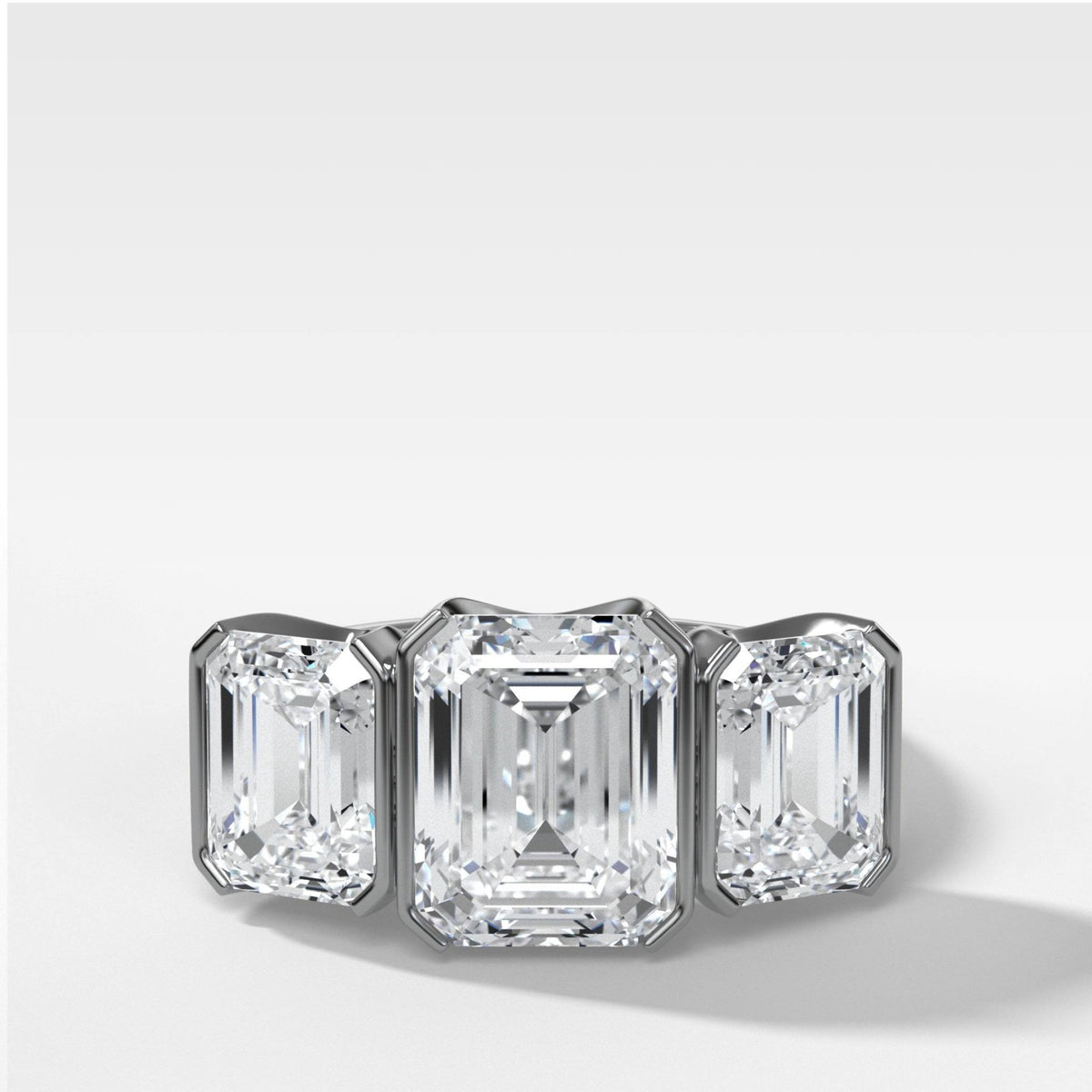Half Bezel Triad Engagement Ring With Emerald Cut Diamonds - GOODSTONE