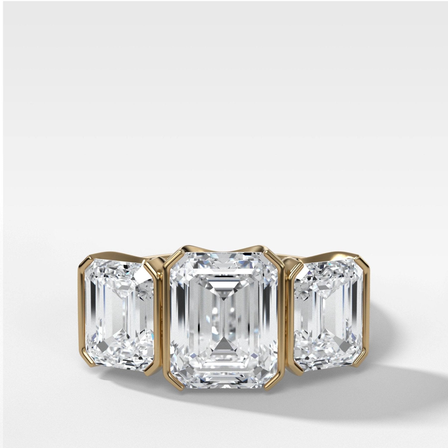 Half Bezel Triad Engagement Ring With Emerald Cut Diamonds - GOODSTONE