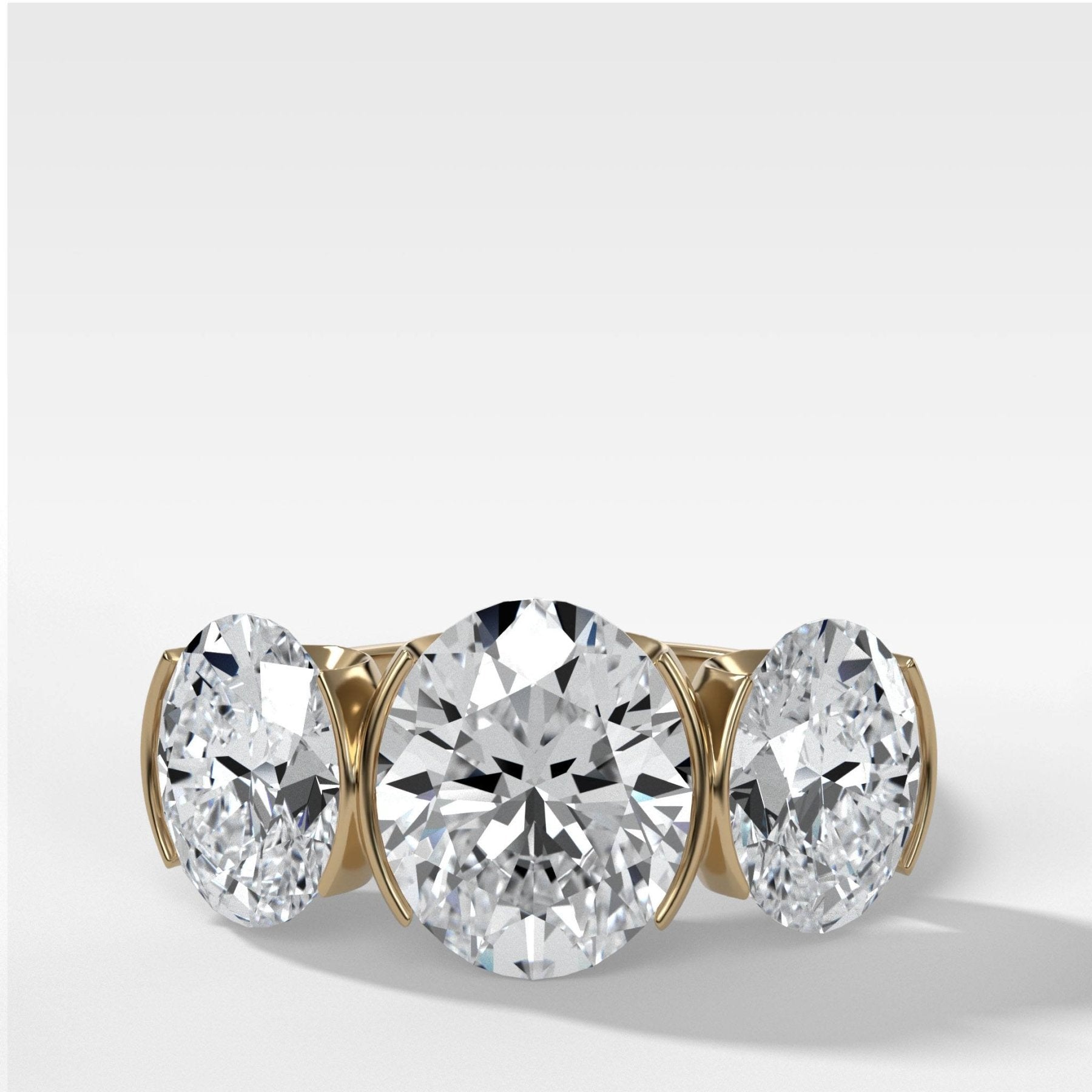 Half Bezel Triad Engagement Ring With Oval Cut Diamonds - GOODSTONE