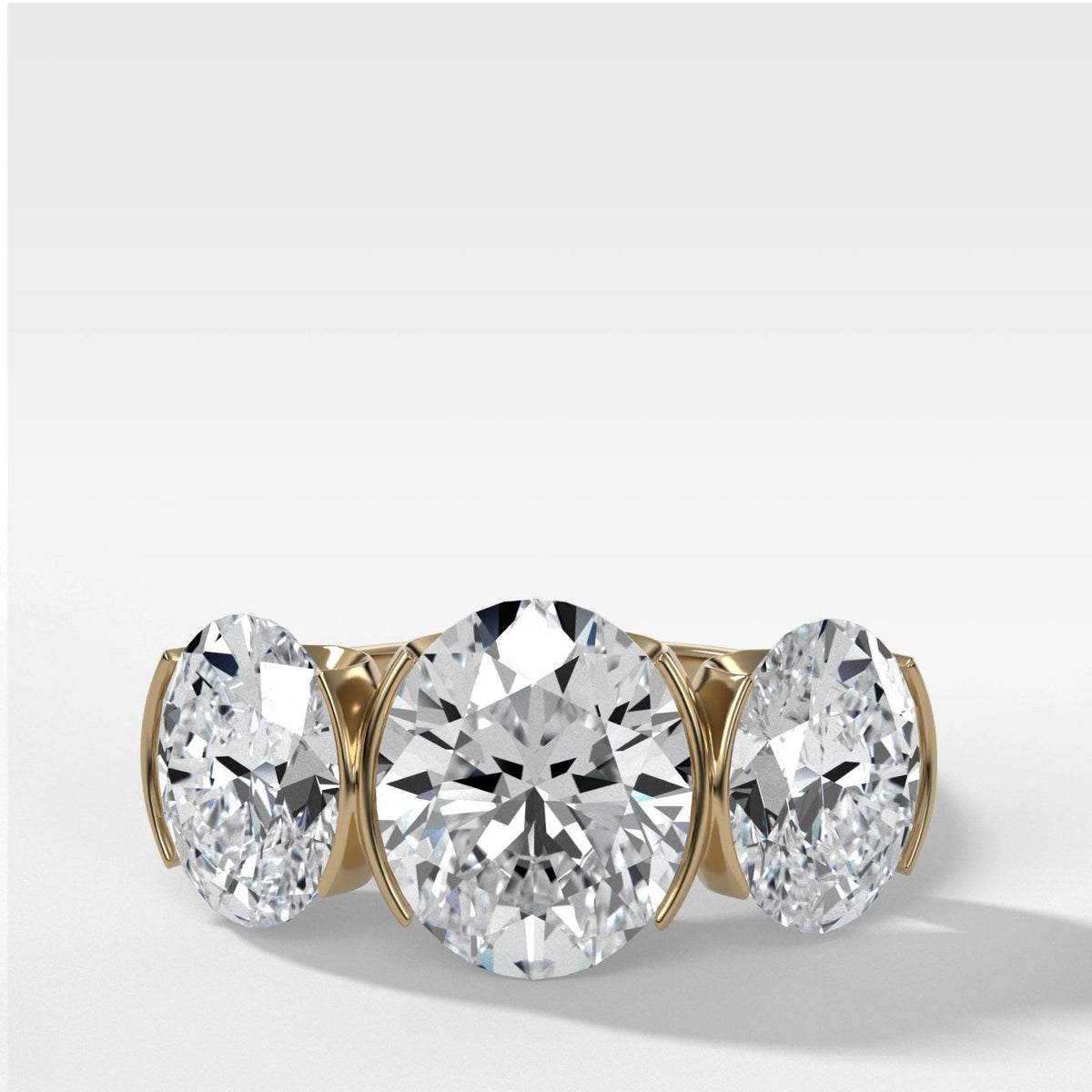 Half Bezel Triad Engagement Ring With Oval Cut Diamonds - GOODSTONE