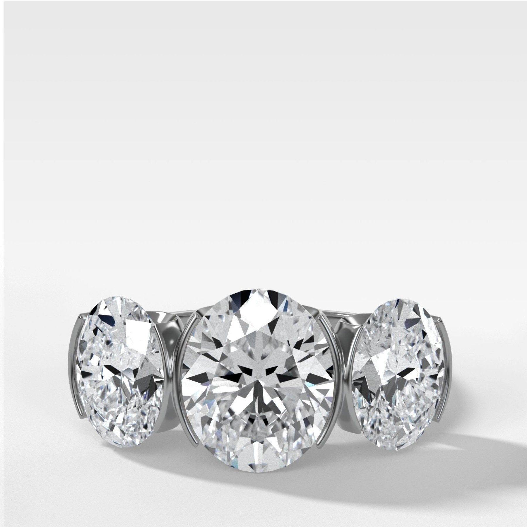 Half Bezel Triad Engagement Ring With Oval Cut Diamonds - GOODSTONE