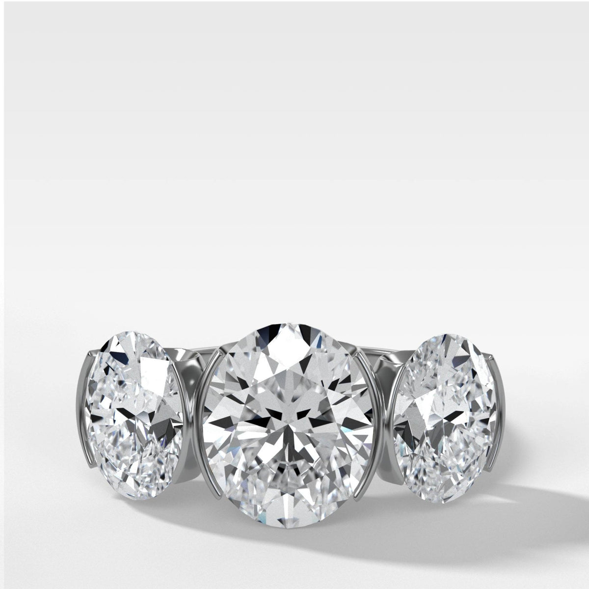 Half Bezel Triad Engagement Ring With Oval Cut Diamonds - GOODSTONE