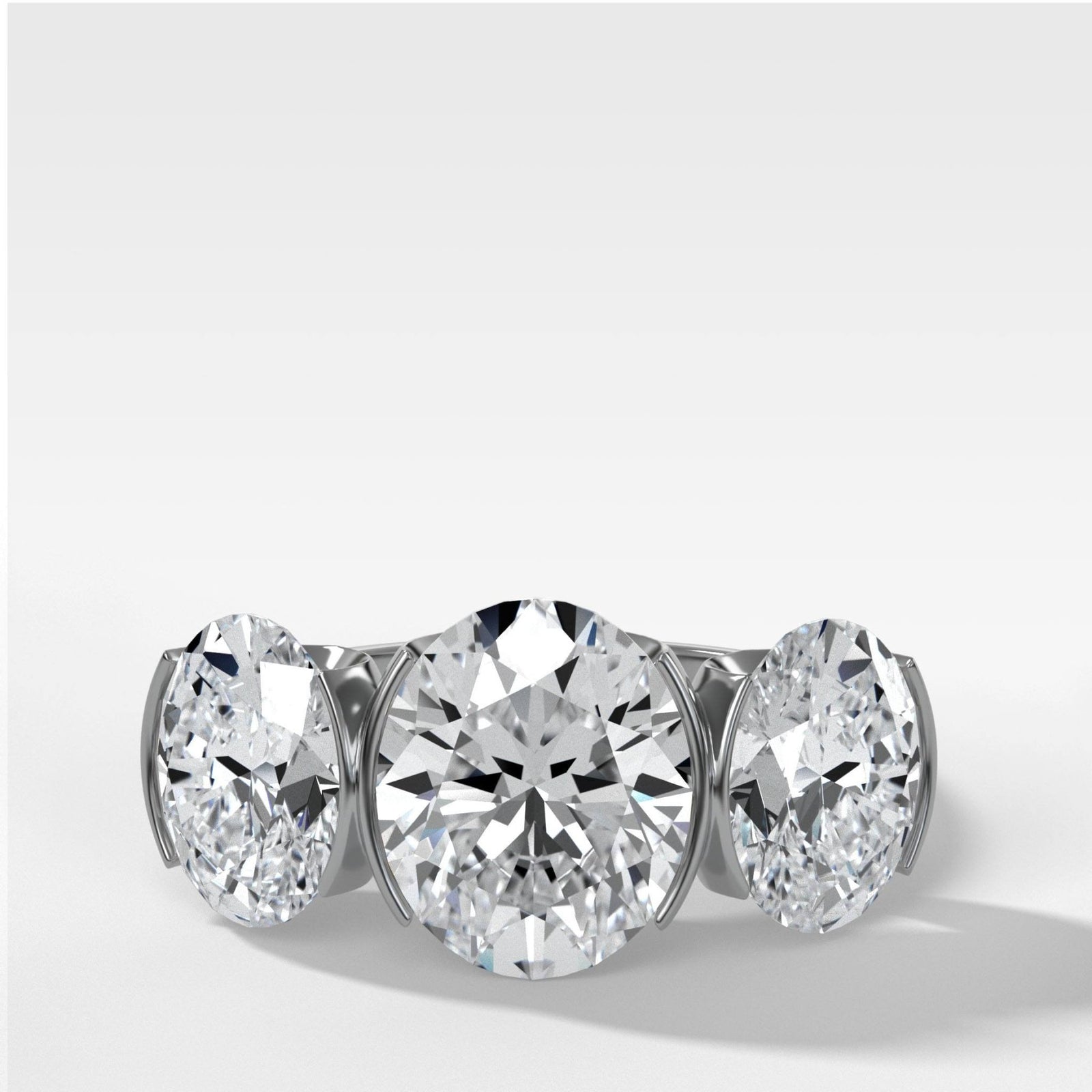 Half Bezel Triad Engagement Ring With Oval Cut Diamonds - GOODSTONE
