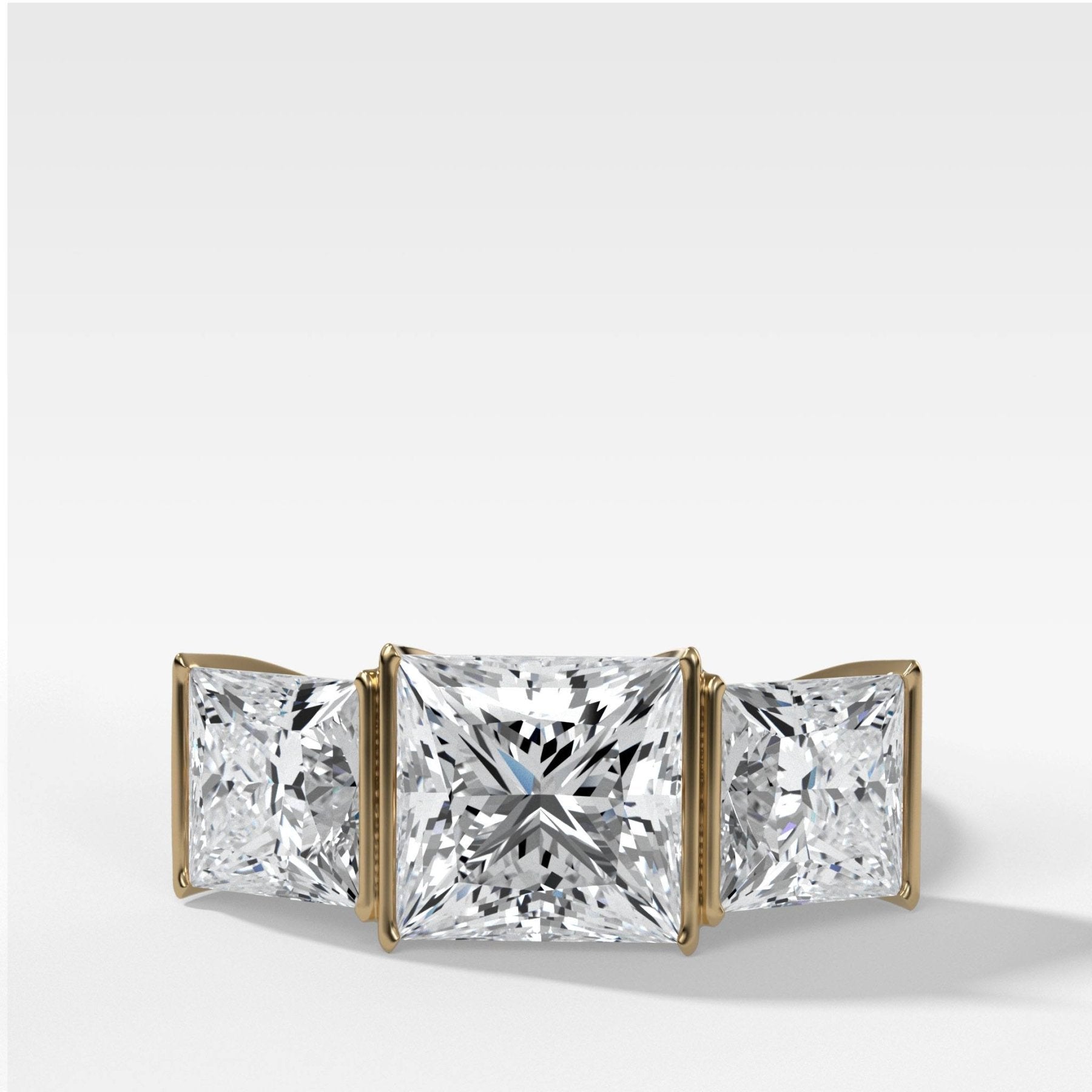 Half Bezel Triad Engagement Ring With Princess Cut Diamonds - GOODSTONE