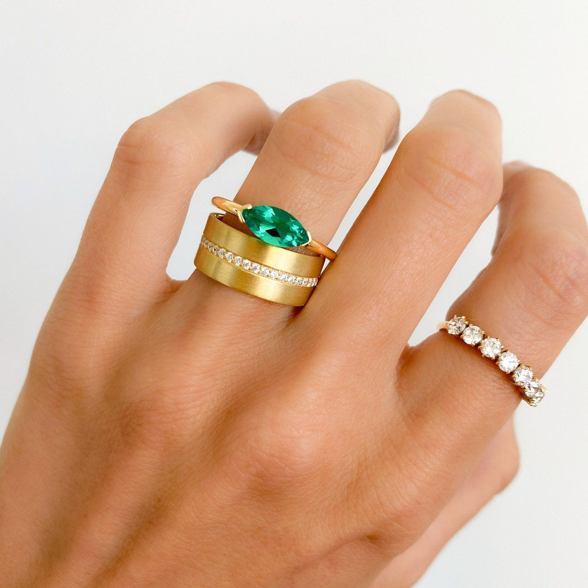 East West Half Bezel Solitaire Engagement Ring With Green Emerald Marquise Cut by Good Stone available in Gold and Platinum