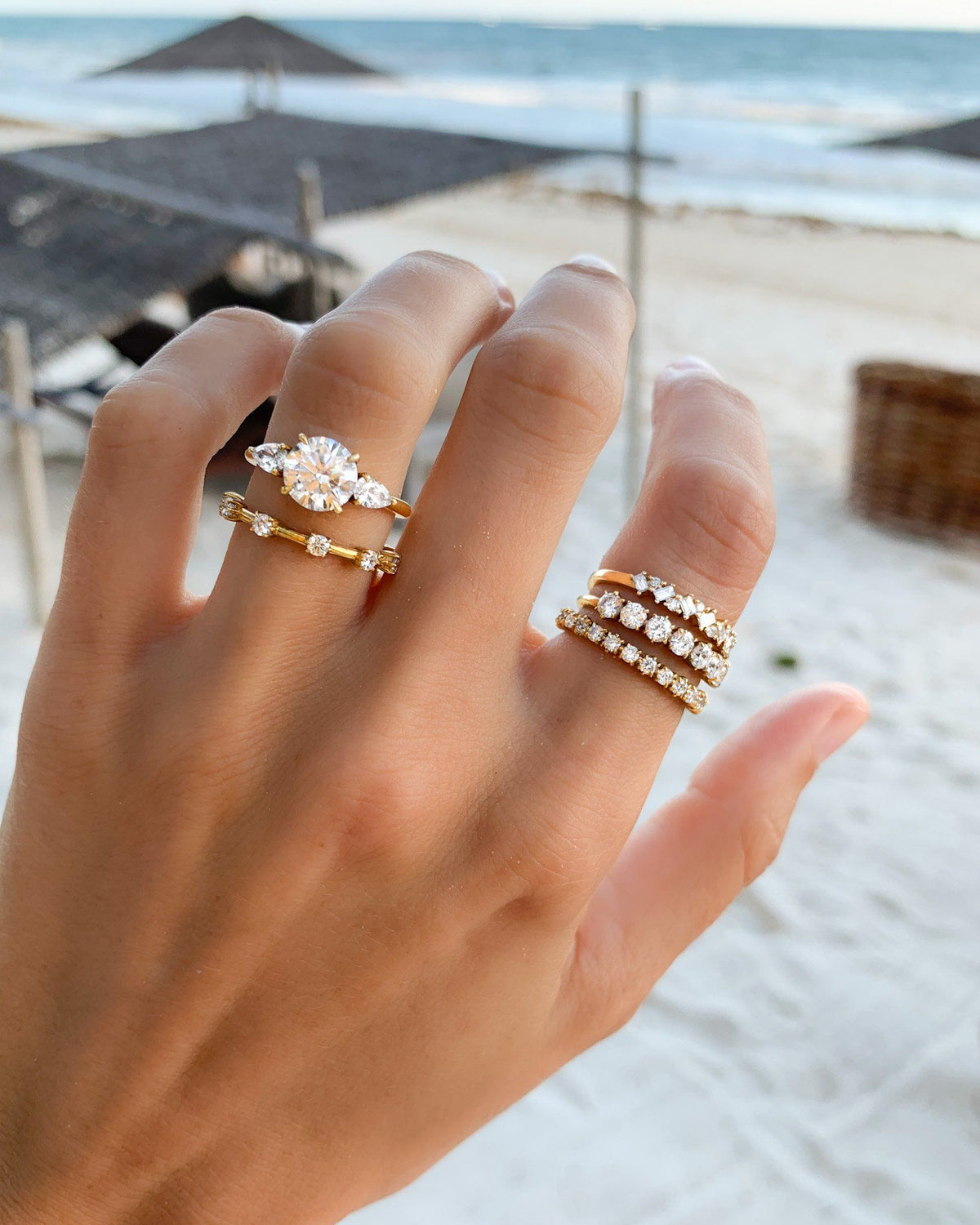 Round diamond with pear shaped side stones Clearance