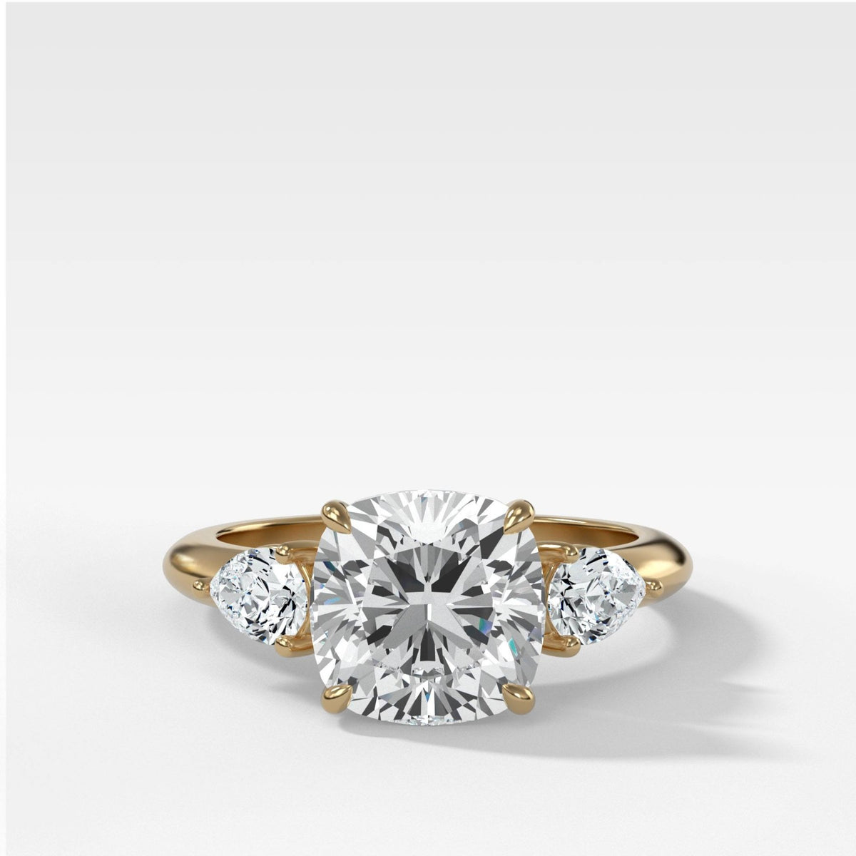 Three Stone Engagement Ring With Pear Side Stones and Cushion Cut Diamond - GOODSTONE