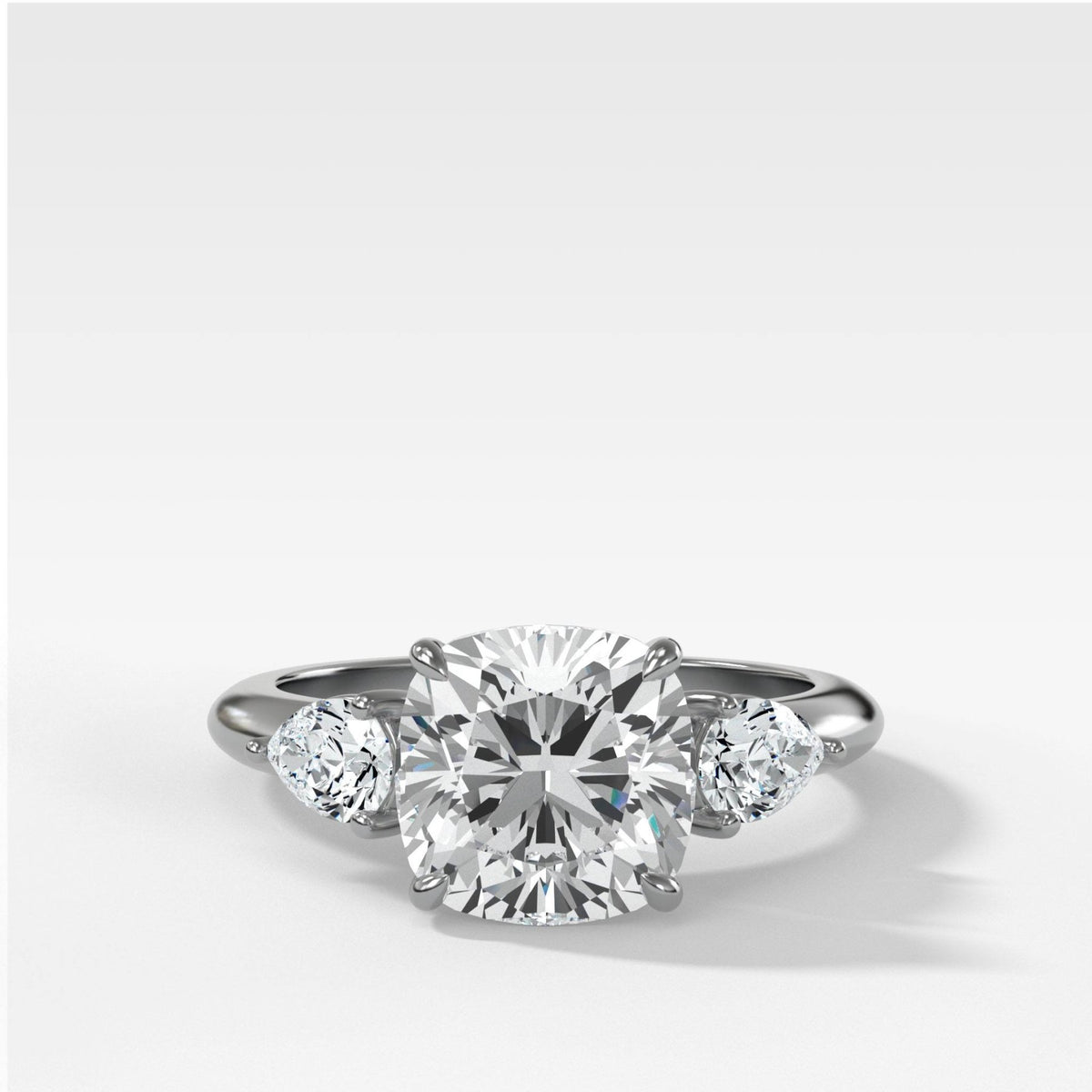 Three Stone Engagement Ring With Pear Side Stones and Cushion Cut Diamond - GOODSTONE