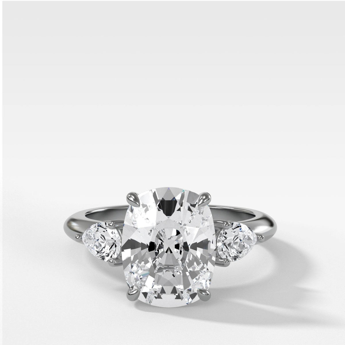 Three Stone Engagement Ring With Pear Side Stones and Elongated Cushion Cut Diamond - GOODSTONE