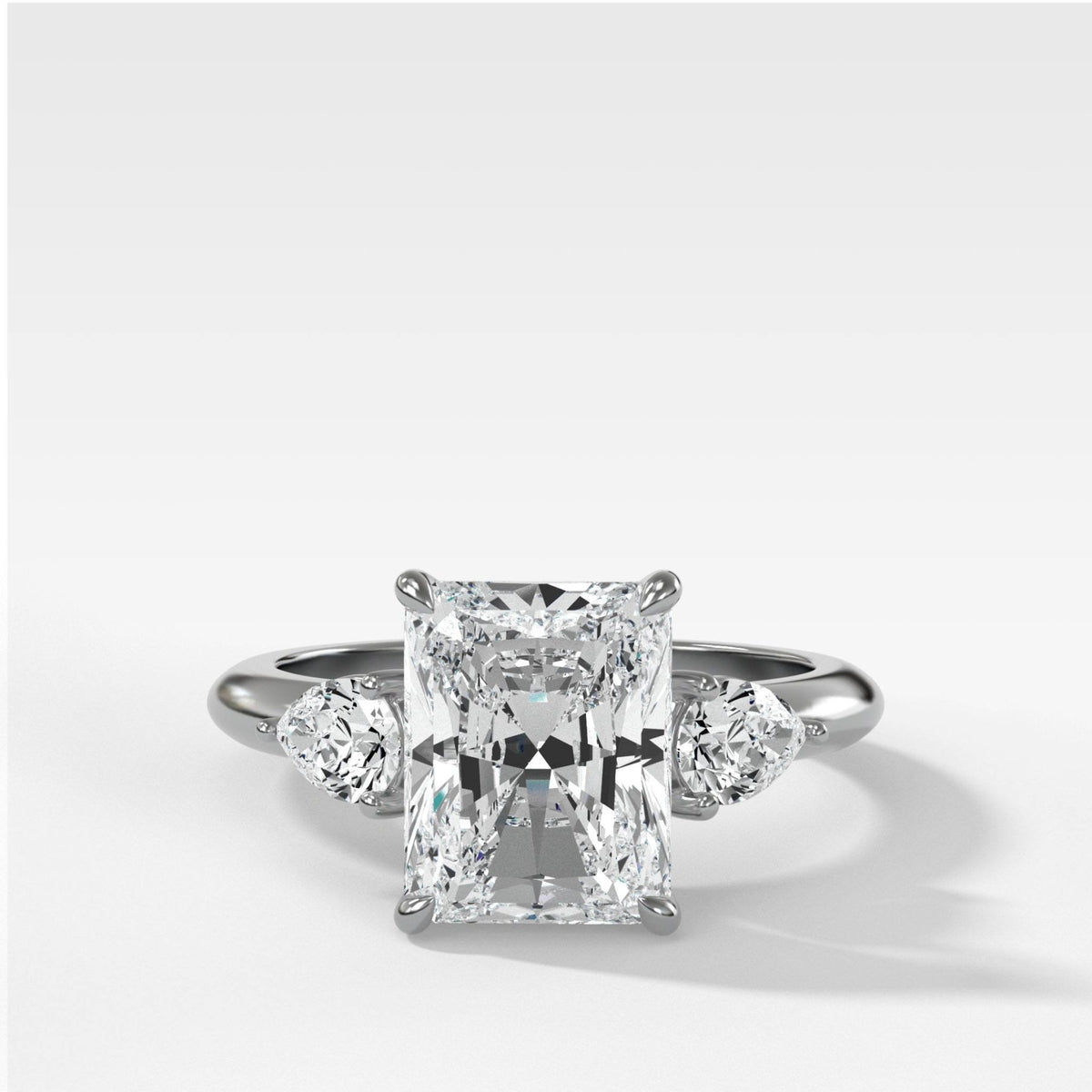 Three Stone Engagement Ring With Pear Side Stones and Elongated Radiant Cut Diamond - GOODSTONE