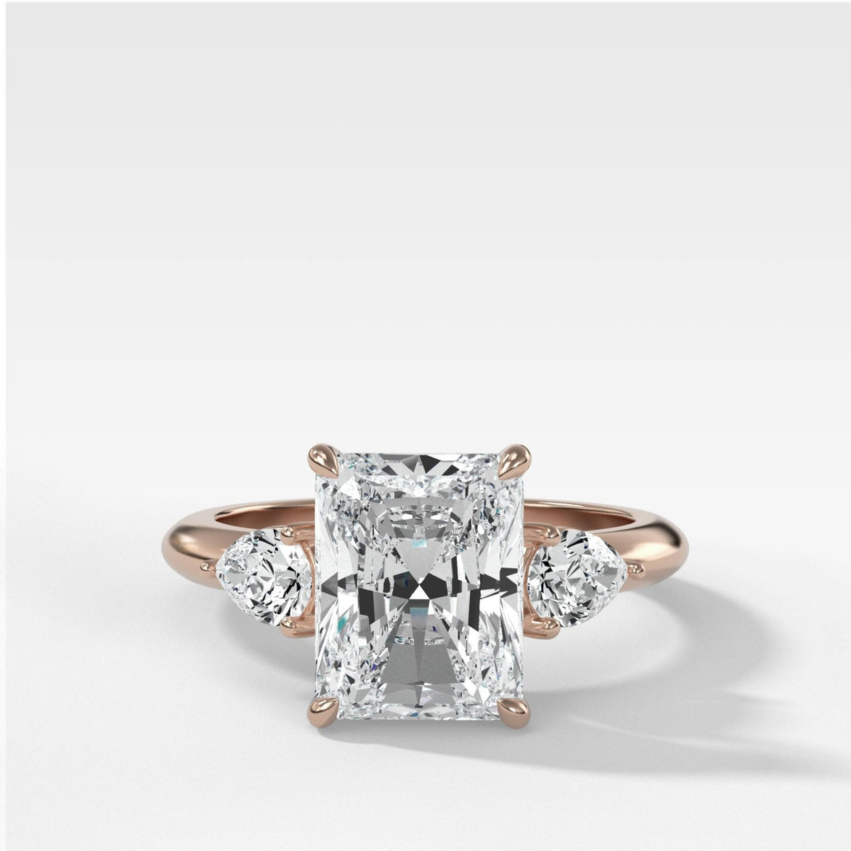 Three Stone Engagement Ring With Pear Side Stones and Elongated Radiant Cut Diamond - GOODSTONE