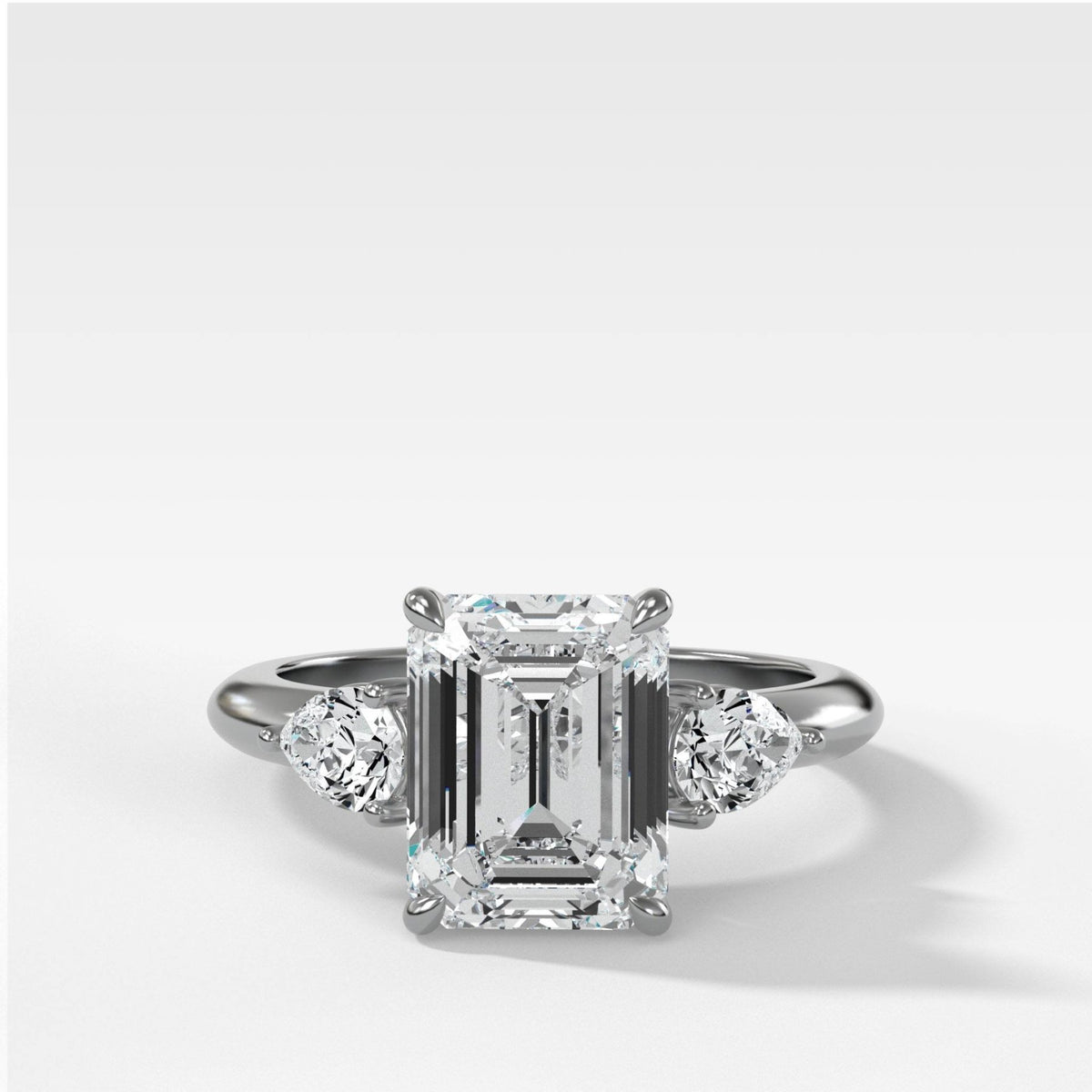 Three Stone Engagement Ring With Pear Side Stones and Emerald Cut Diamond - GOODSTONE
