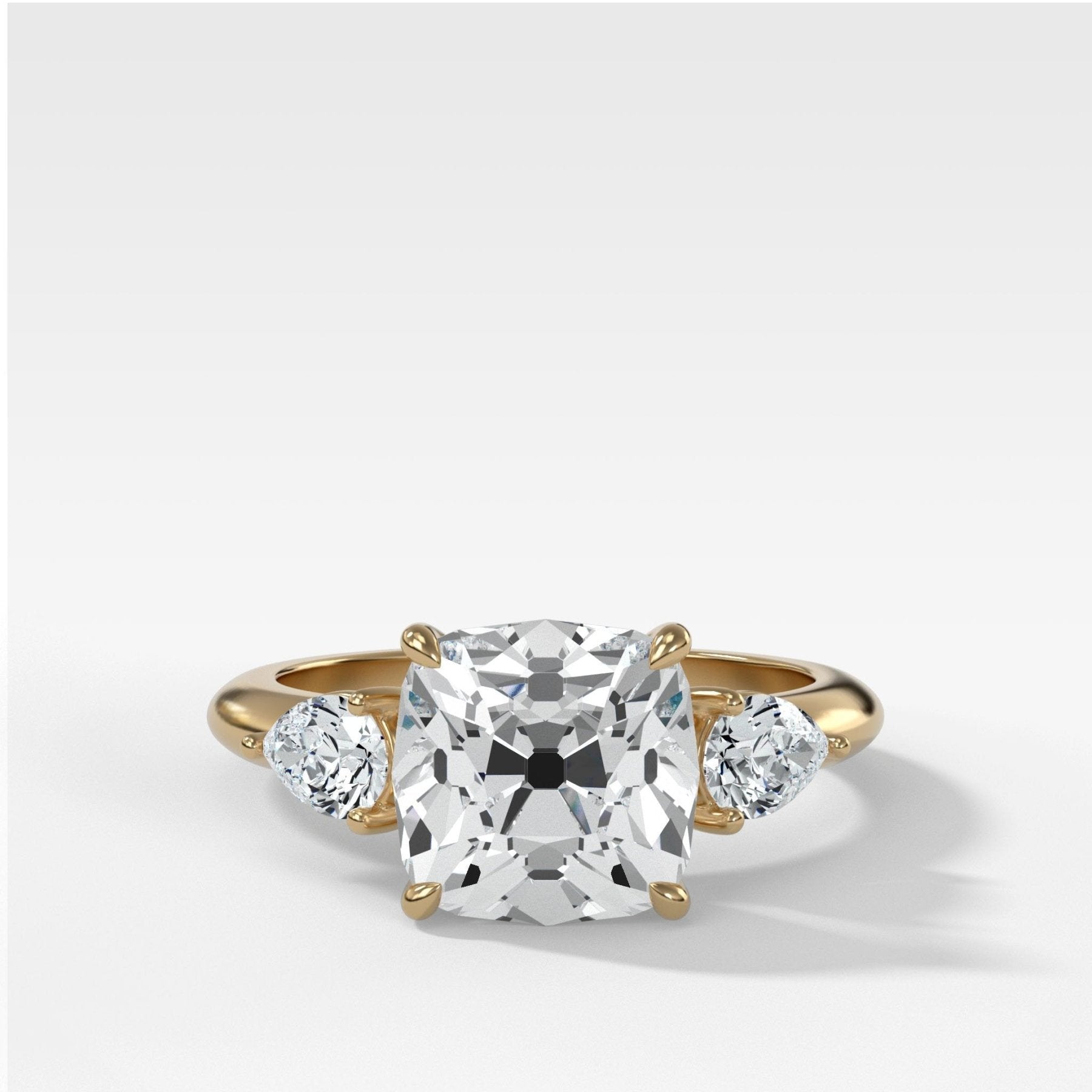 Three Stone Engagement Ring With Pear Side Stones and Old Mine Cut Dia