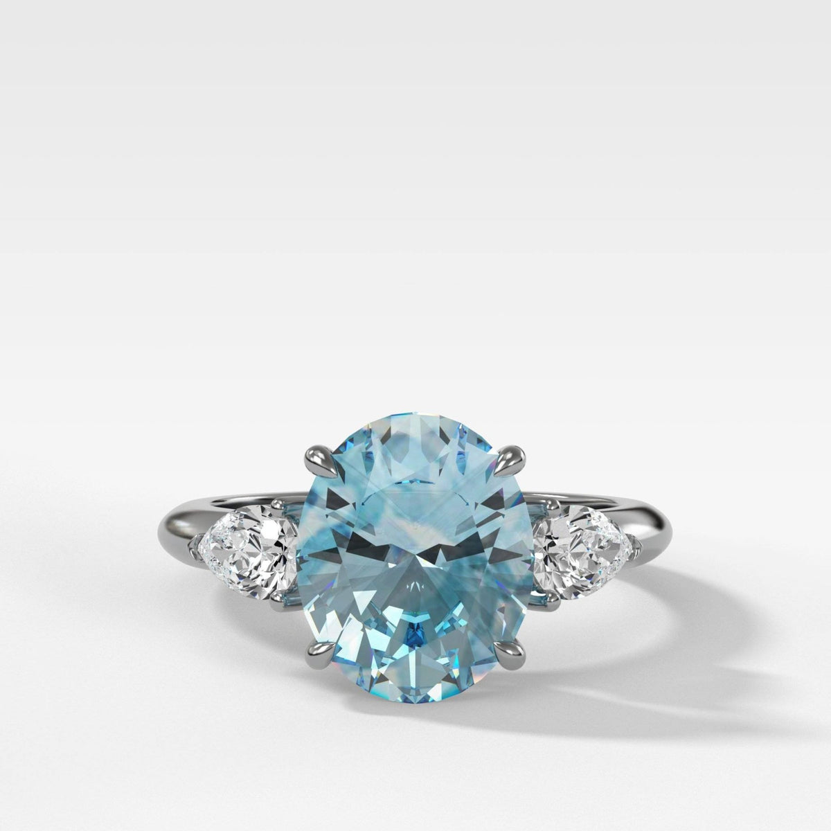 Three Stone Engagement Ring With Pear Side Stones and Oval Cut Aquamarine - GOODSTONE