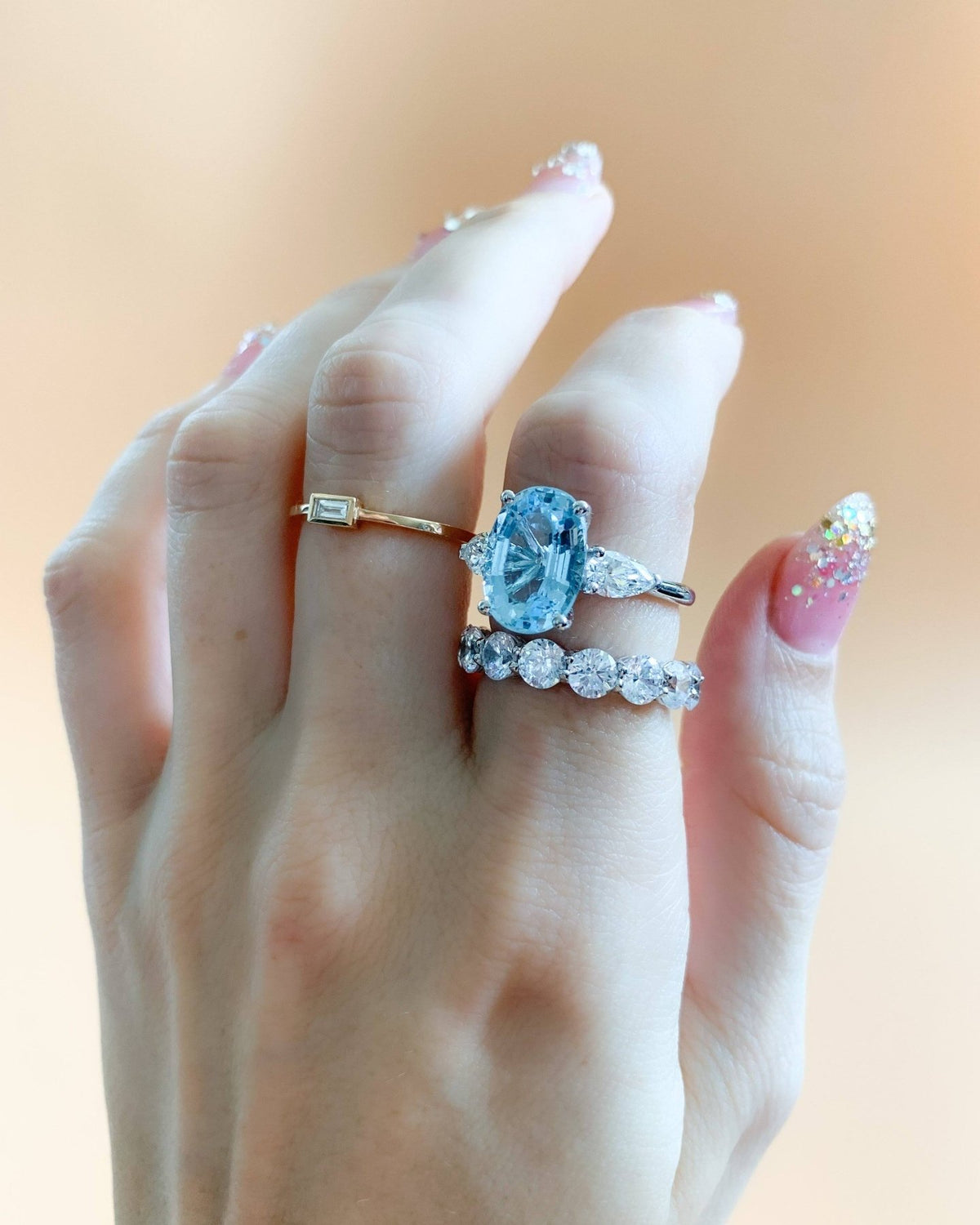 Three Stone Engagement Ring With Pear Side Stones and Oval Cut Aquamarine - GOODSTONE