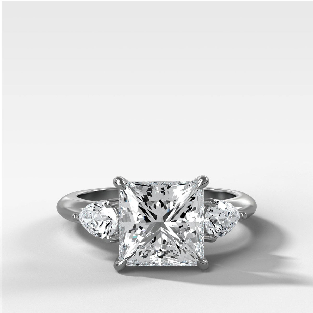 Three Stone Engagement Ring With Pear Side Stones and Princess Cut Diamond - GOODSTONE