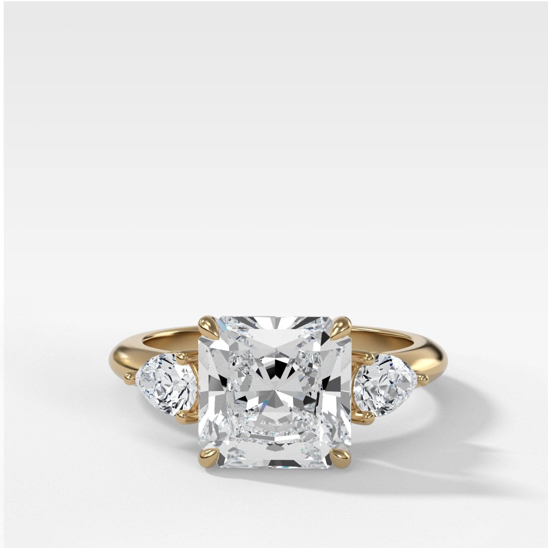 Three Stone Engagement Ring With Pear Side Stones and Radiant Square Cut Diamond - GOODSTONE