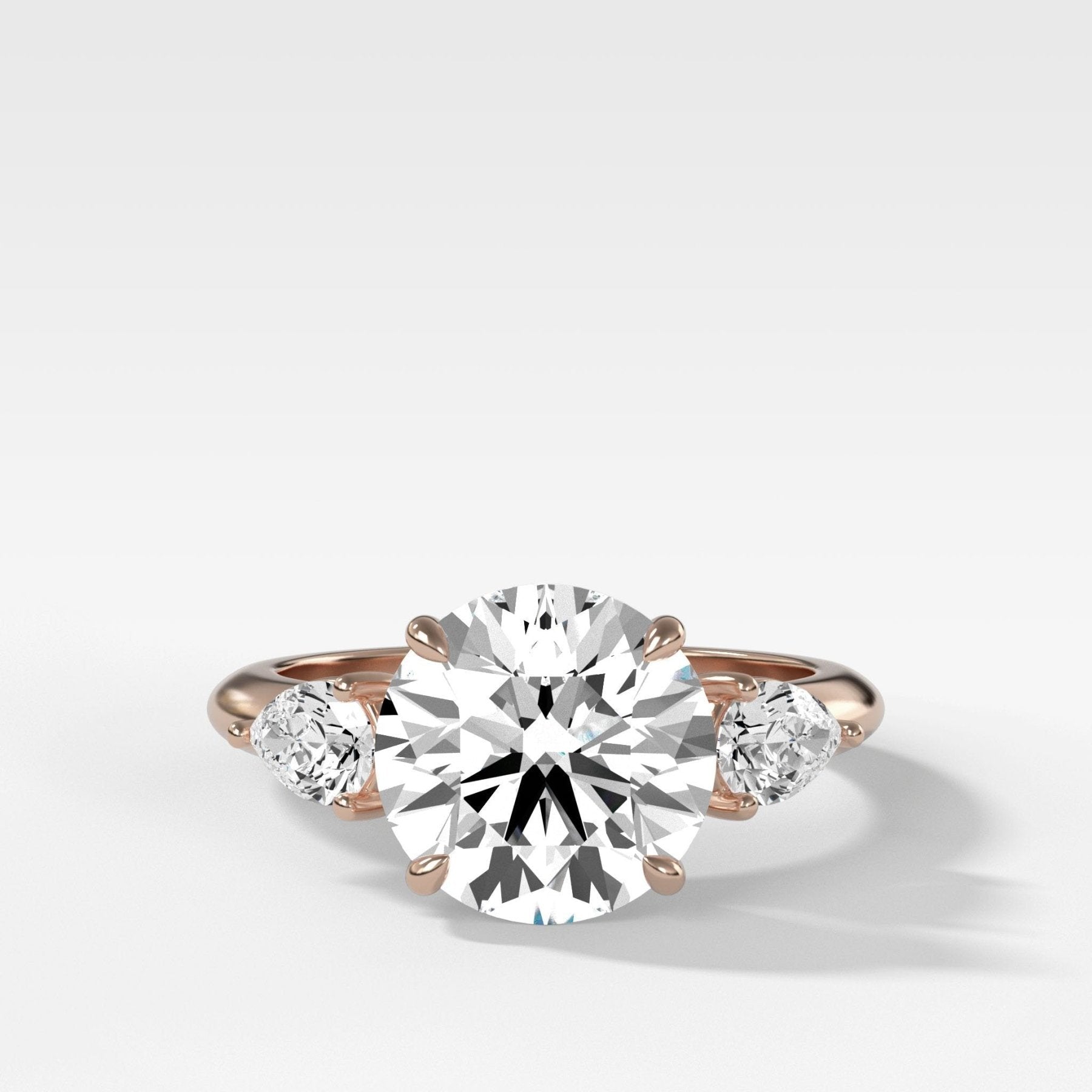 Three Stone Engagement Ring With Pear Side Stones With Round Cut Diamo