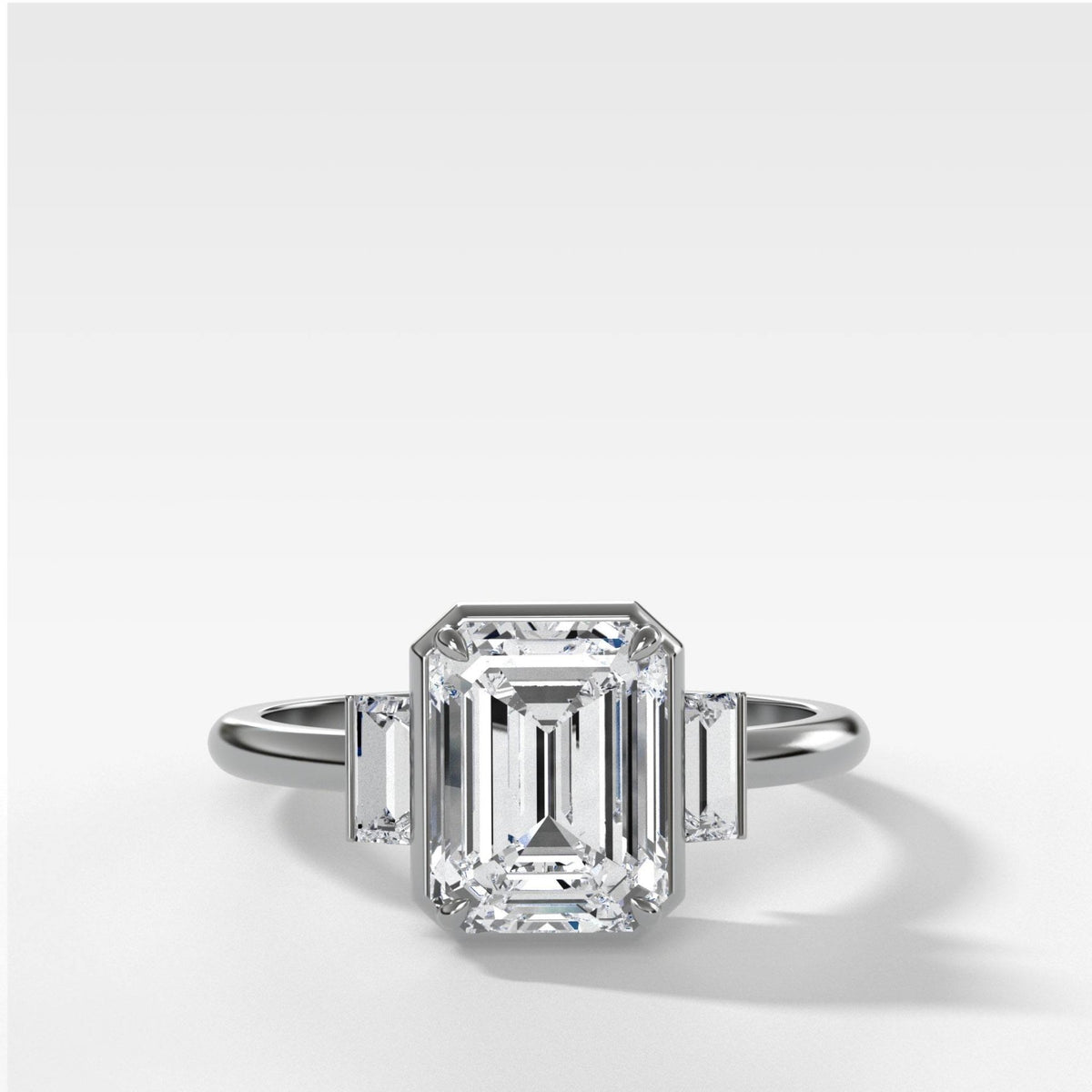 Three Stone Engagement Ring With Straight Baguette Side Stones and Emerald Cut Diamond - GOODSTONE