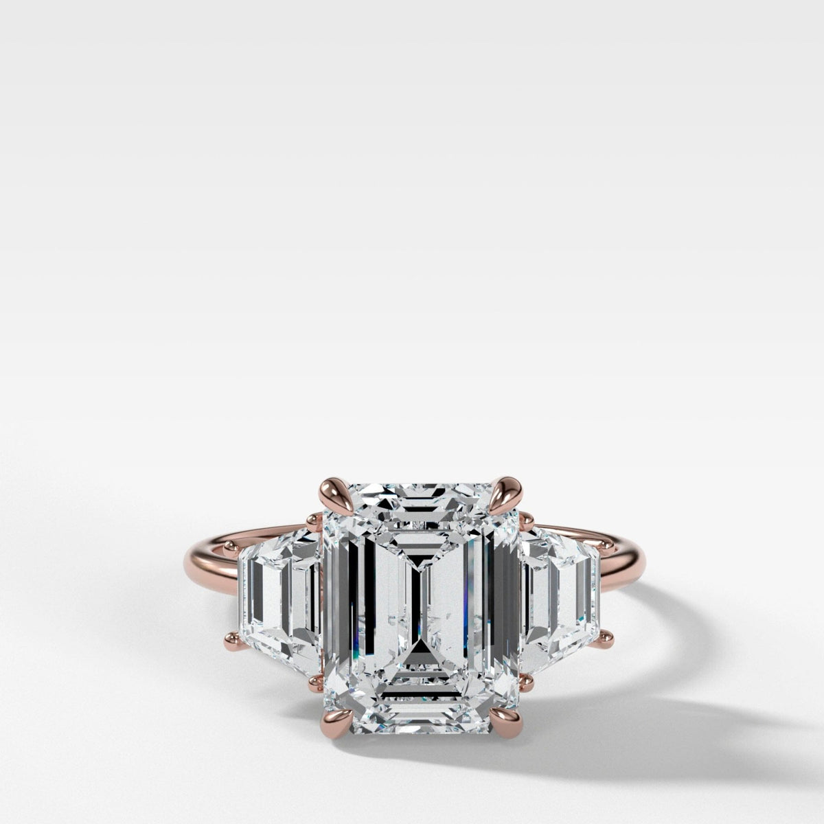 Three Stone ring with Trapezoid side diamonds and an Emerald cut - GOODSTONE